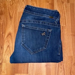 Blue skinny jeans with zipper up ankles